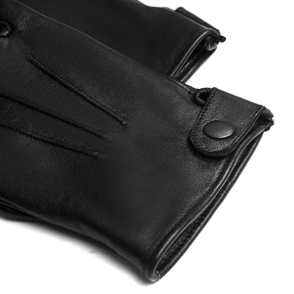 Black leather wristlet or glove with a snap-button closure, shown in a close-up studio shot on a white background.