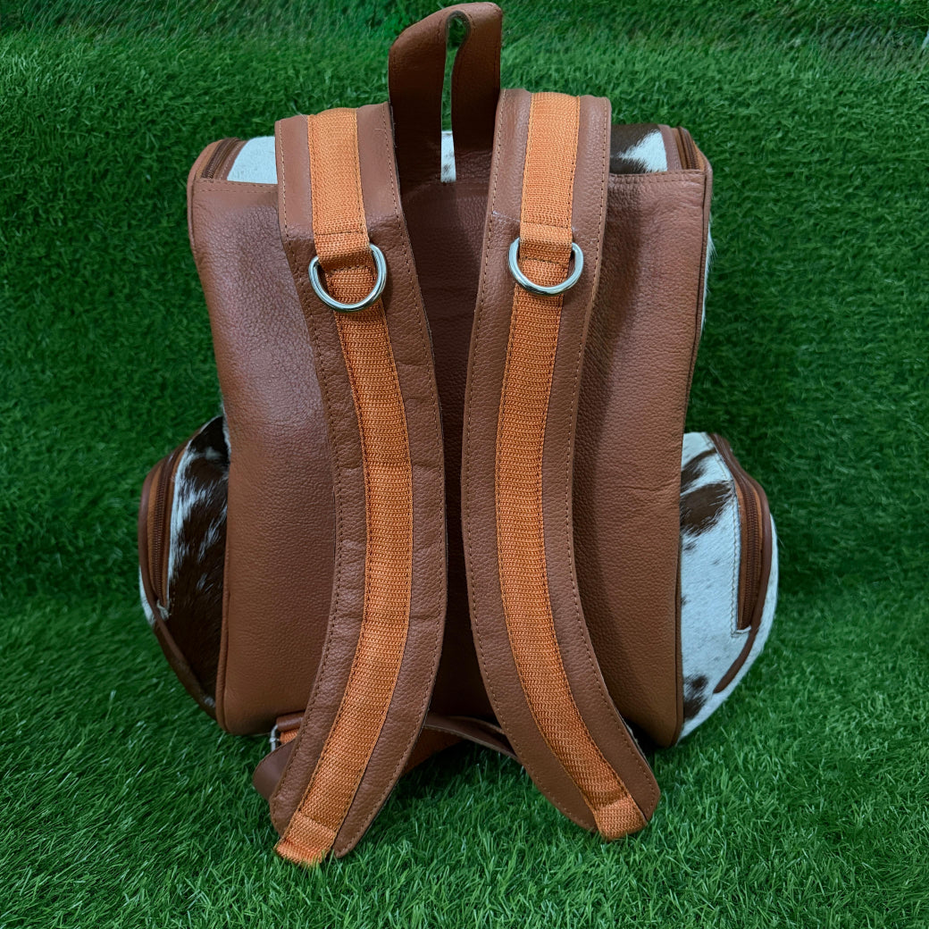Cowhide backpack carried as everyday shoulder bag