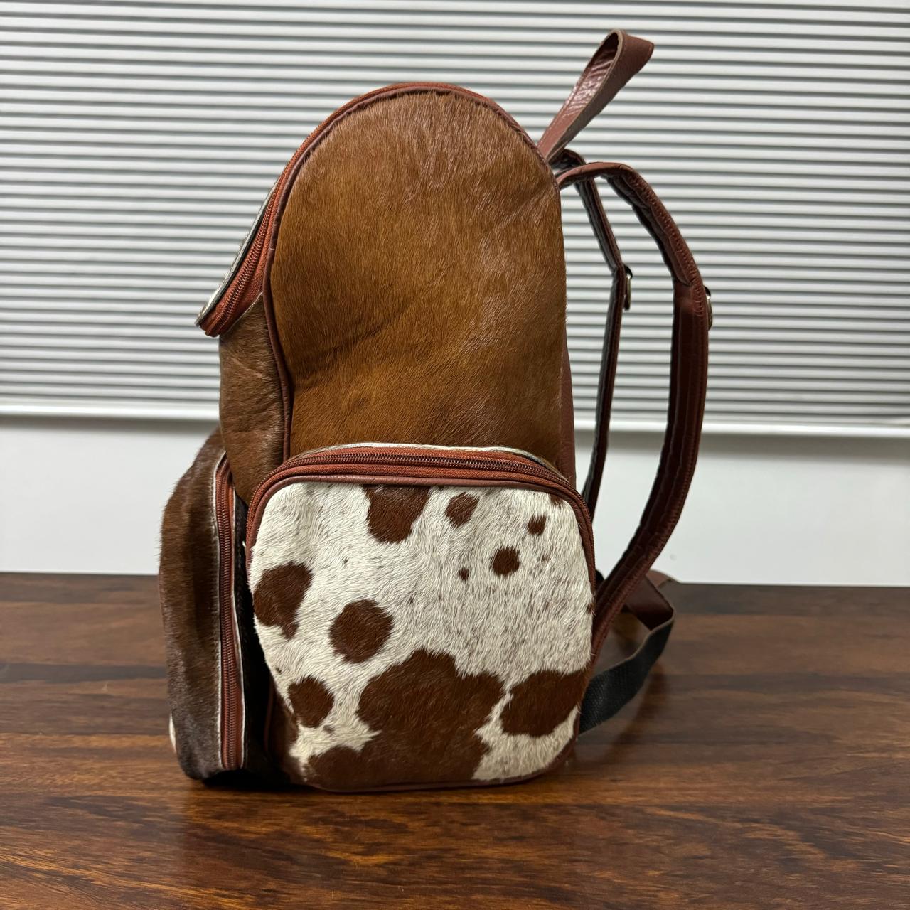 Cowhide backpack front zipper pocket close-up detail