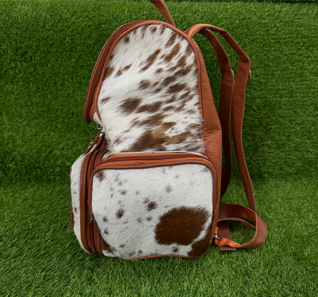 Cowhide backpack packed with daily essentials