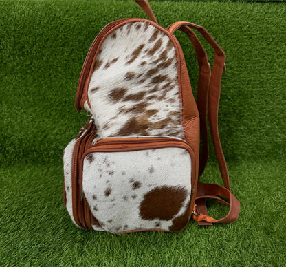 Cowhide backpack packed with daily essentials