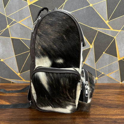 Cowhide diaper backpack carried on shoulder, size reference