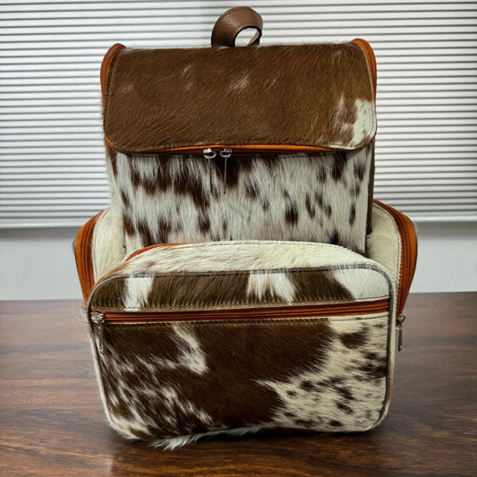 Cowhide diaper backpack front view, brown and white pattern