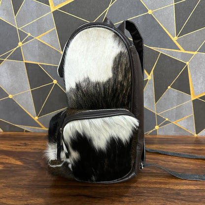 Cowhide diaper backpack packed with baby essentials