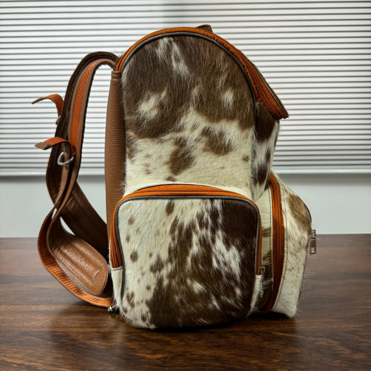 Cowhide diaper backpack with matching changing pad