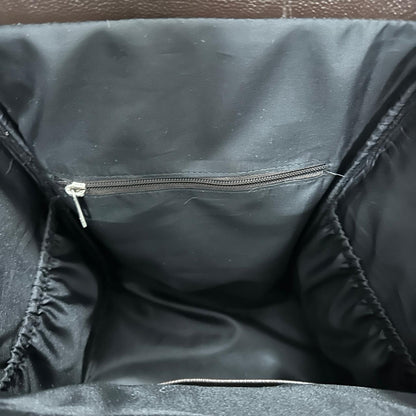 Cowhide diaper bag front pocket and zipper detail