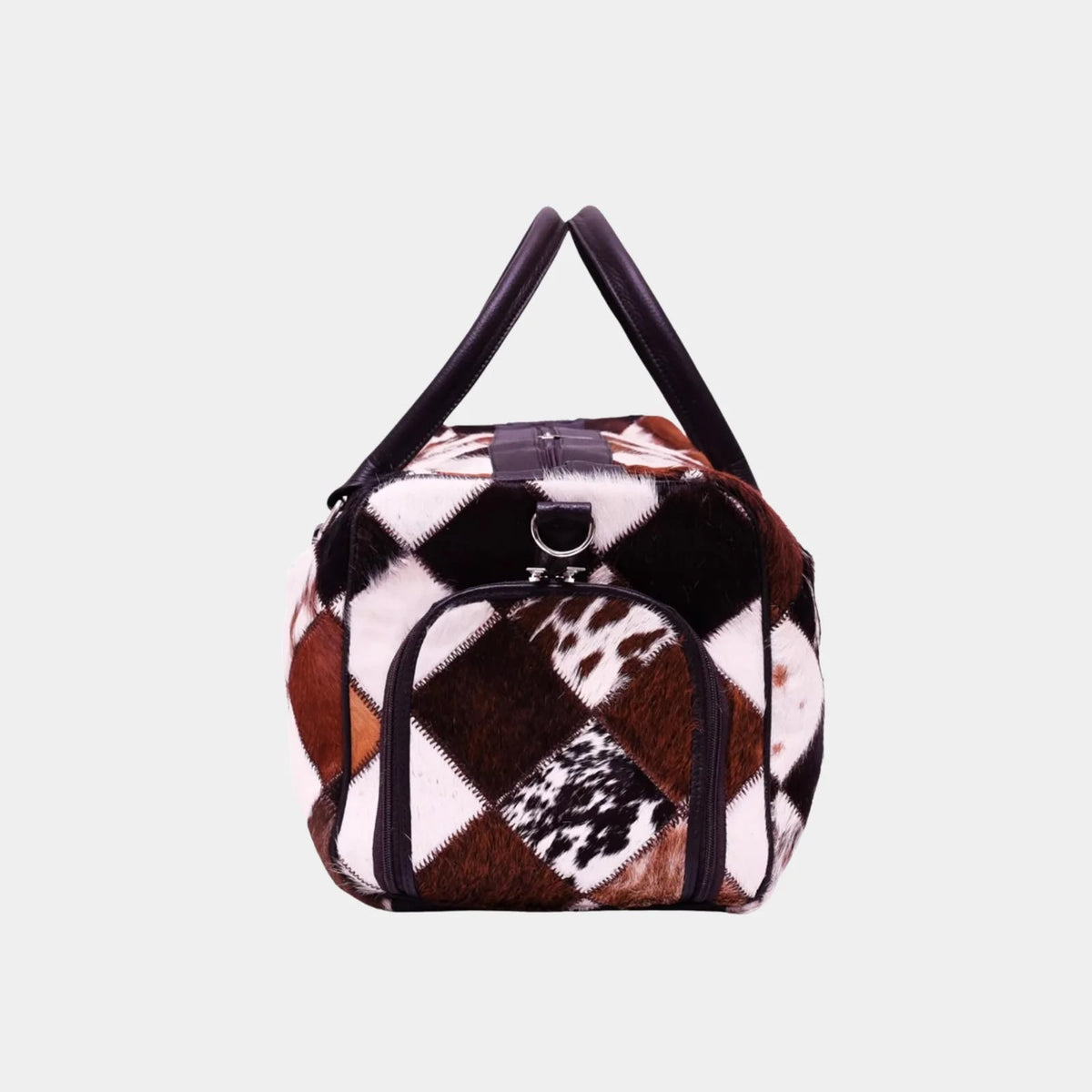 Cowhide duffel bag side view with leather handles