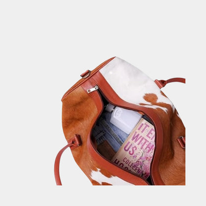 Cowhide duffel bag with adjustable leather shoulder strap