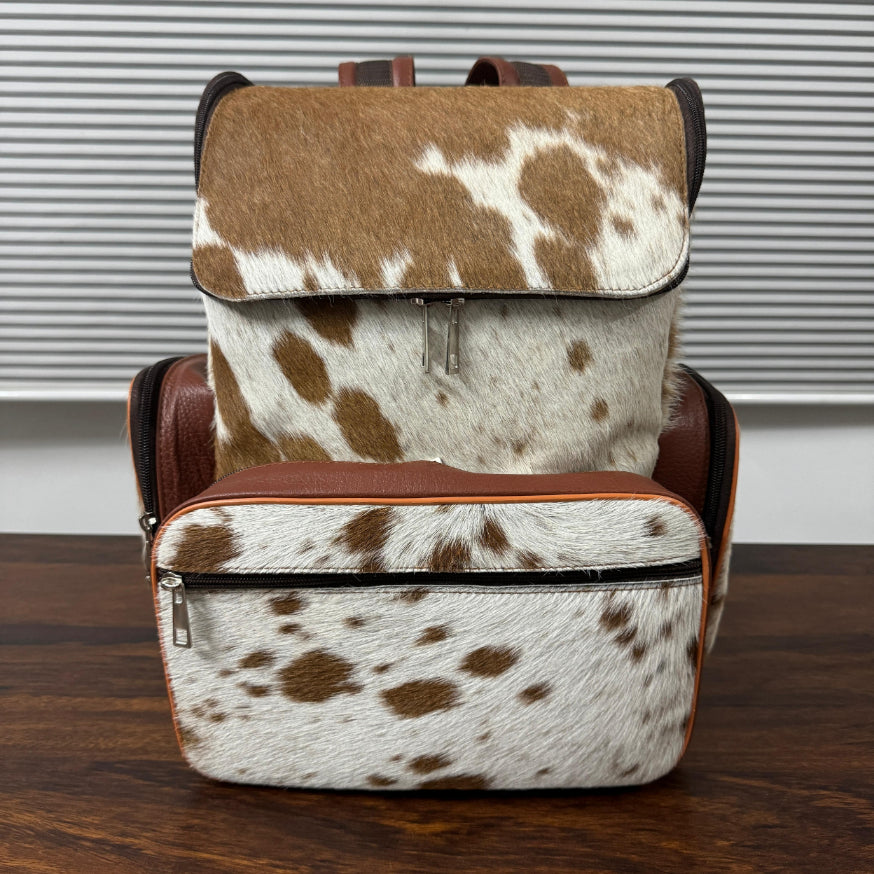 Genuine cowhide leather backpack for women – front view showing natural hide pattern