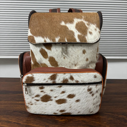 Genuine cowhide leather backpack for women – front view showing natural hide pattern