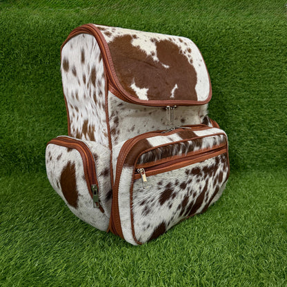 Handmade cowhide backpack front view, brown white and black pattern