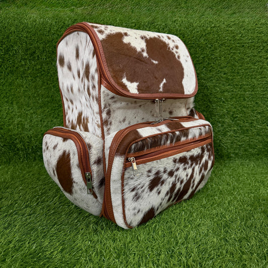 Handmade cowhide backpack front view, brown white and black pattern
