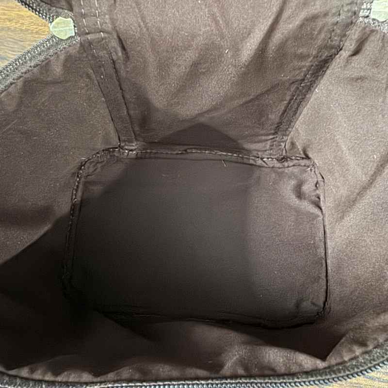 interior veiw of Black and white cowhide cosmetic and toiletry travel bags with leather trim and zipper closure