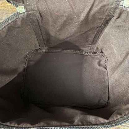 interior veiw of Black and white cowhide cosmetic and toiletry travel bags with leather trim and zipper closure
