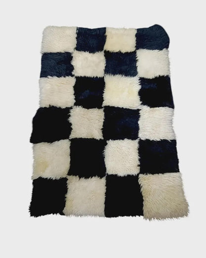 Black and white 4 by 6 foot patchwork sheepskin rug