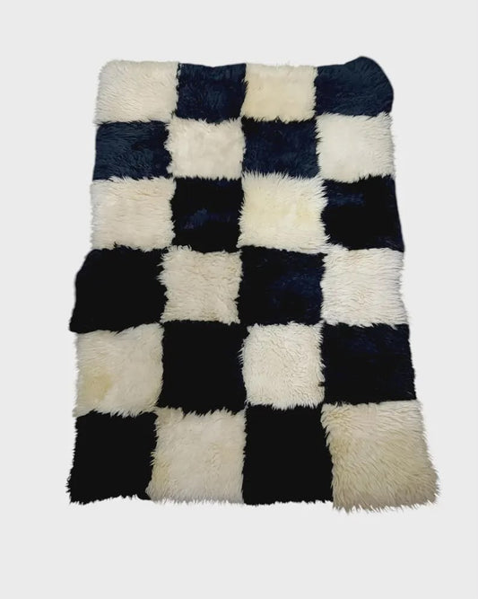 Black and white 4 by 6 foot patchwork sheepskin rug