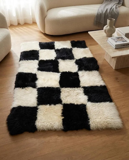 Black and white sheepskin area rug in a neutral modern living room