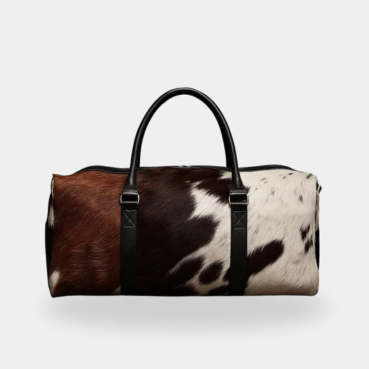 Brown and white cowhide travel duffel bag front view