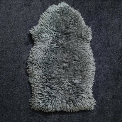 Charcoal grey single pelt sheepskin rug showing its natural shape and wool texture