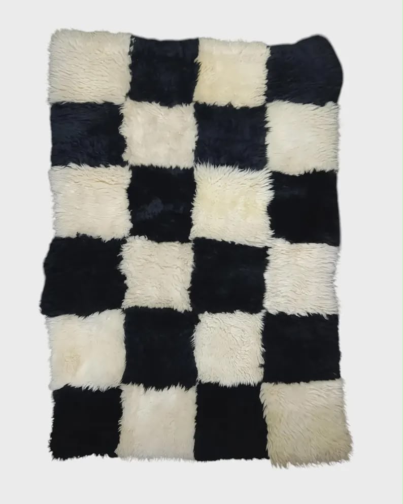 Genuine black and white sheepskin patchwork rug with square design