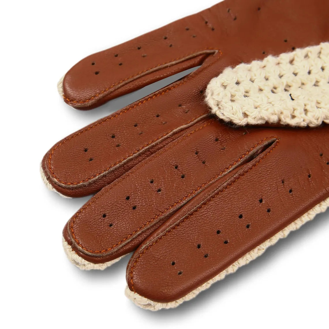 A close-up of a brown leather glove with perforated finger sections and a cream-colored crocheted cuff, shown on a white background.