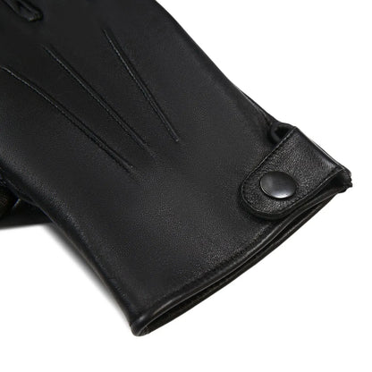 Close-up of a black leather glove showing the wrist cuff with a snap button closure, on a plain white background.