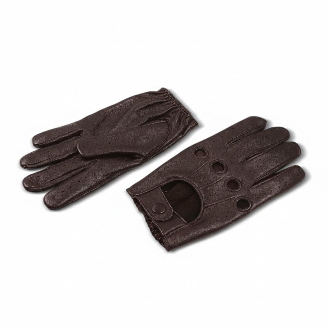 A pair of dark brown leather driving gloves, one showing the back of the hand with perforations and the other showing the palm side with a thumbhole cutout, on a plain white background.