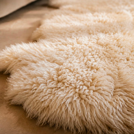 Natural cream sheepskin pelt rug with soft wool texture
